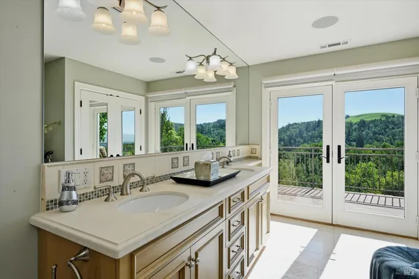 a kitchen with a sink appliances and cabinets