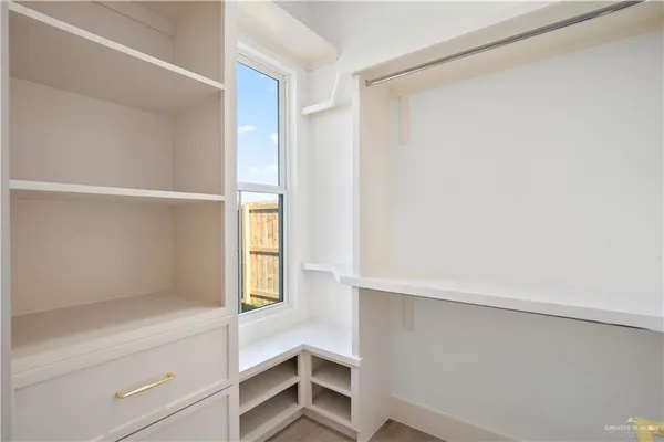 a view of an empty walk in closet