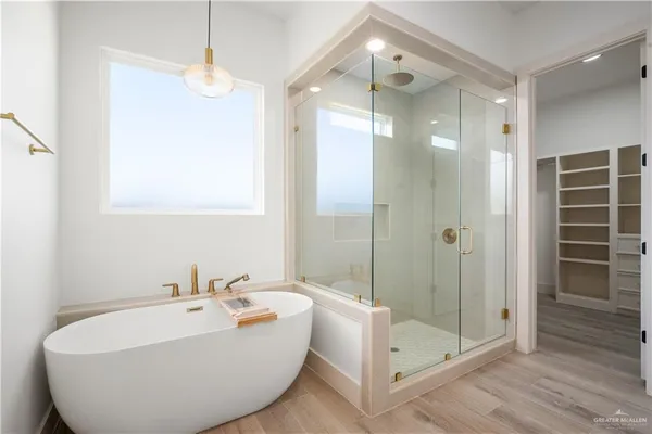 a bathroom with a bathtub and a shower