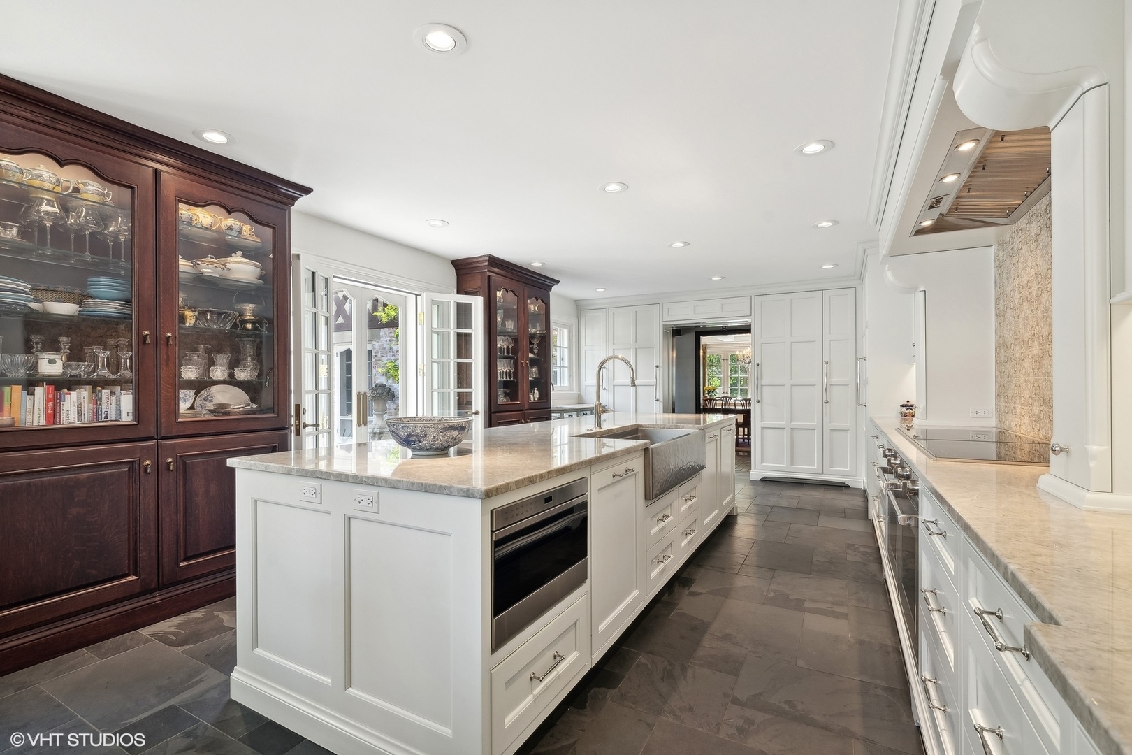 885 Maplewood Road Lake Forest, IL 60045 - Photo 13 of 78 a large white kitchen with a large window and stainless steel appliances