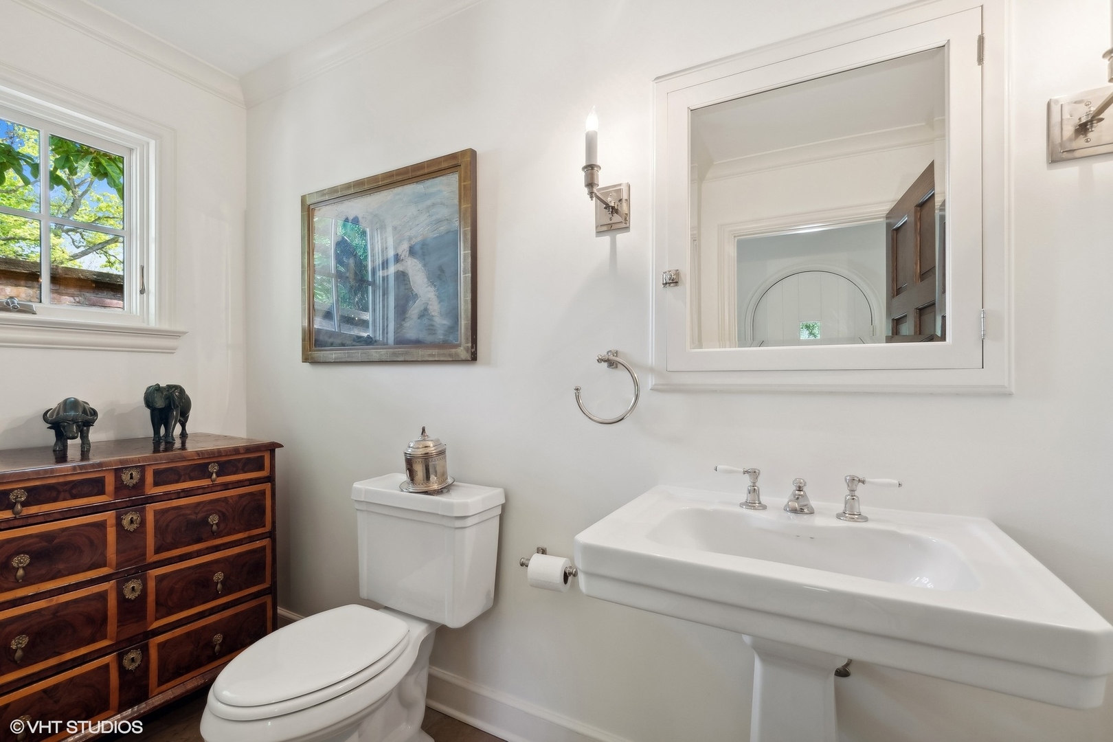 885 Maplewood Road Lake Forest, IL 60045 - Photo 26 of 78 a bathroom with a toilet a sink and mirror