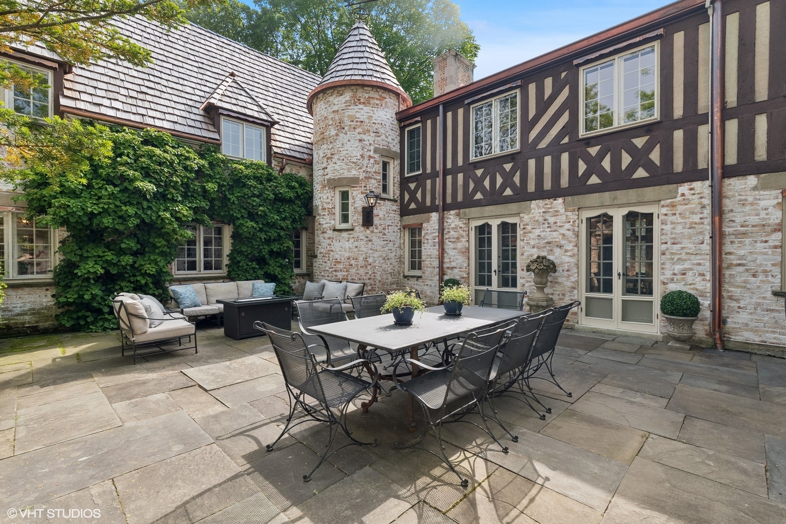 885 Maplewood Road Lake Forest, IL 60045 - Photo 51 of 78 a backyard of a house with barbeque oven table and chairs