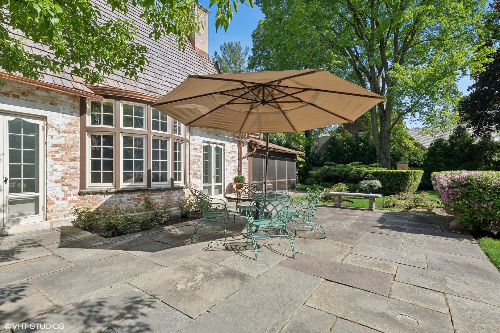 885 Maplewood Road Lake Forest, IL 60045 - Photo 60 of 78 a view of a chair and table under an umbrella
