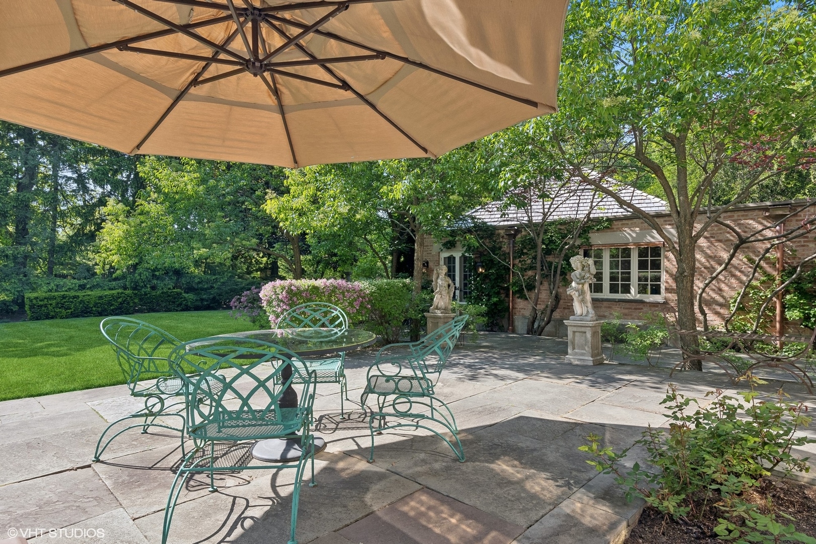 885 Maplewood Road Lake Forest, IL 60045 - Photo 63 of 78 a view of a chair and table in the garden