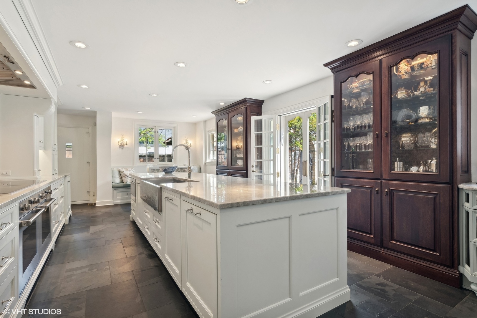 885 Maplewood Road Lake Forest, IL 60045 - Photo 10 of 78 a large kitchen with granite countertop a large window and stainless steel appliances