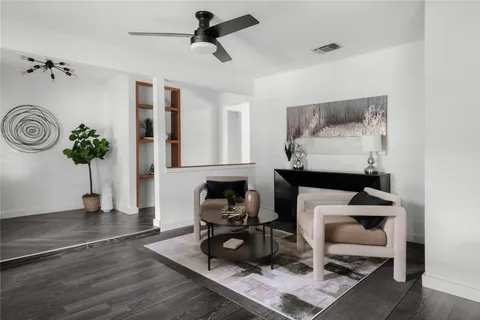 a room with furniture and wooden floor
