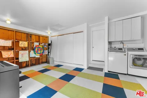 a view of a room with window and toys