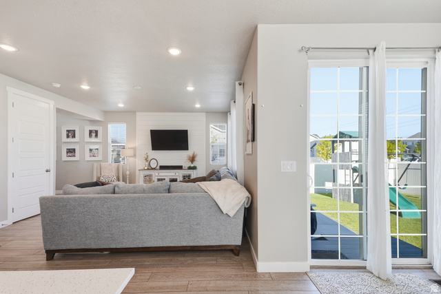 3244 West 1670th Street North Provo, UT 84601 - Photo 21 of 56 Living area with wood-finish flooring, recessed lighting, and a shiplap accent wall