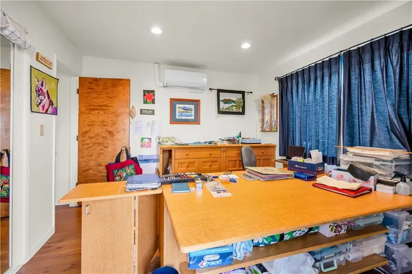 a bathroom with a granite countertop sink a mirror and a shower
