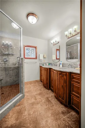 a bathroom with a sink a vanity and a mirror