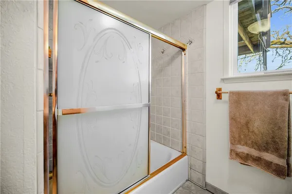 a room that has a rug and a window