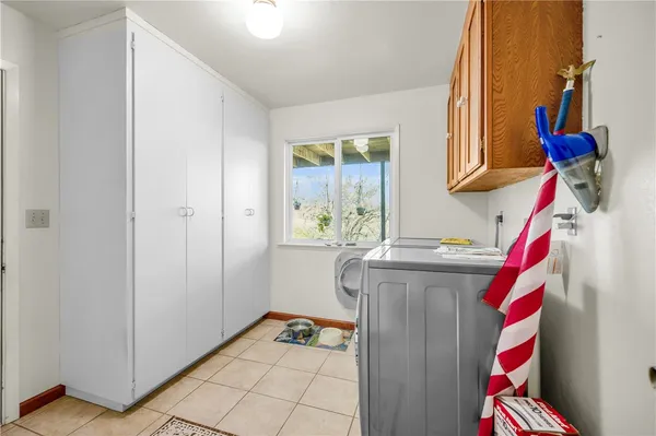 a view of a couches and table in the balcony