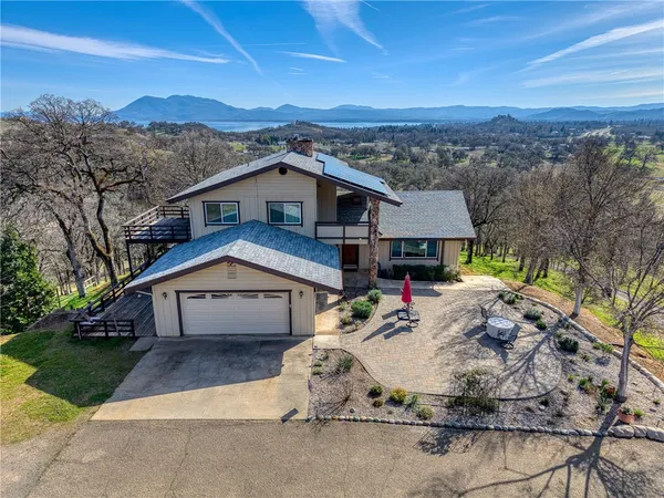 a aerial view of a house with a yard