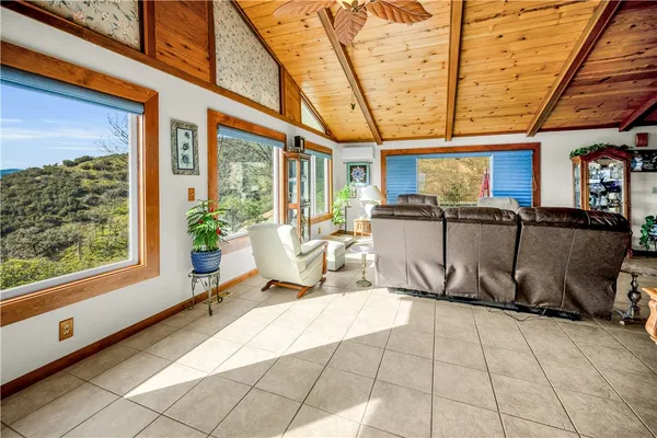 a building outdoor space with patio furniture and potted plants