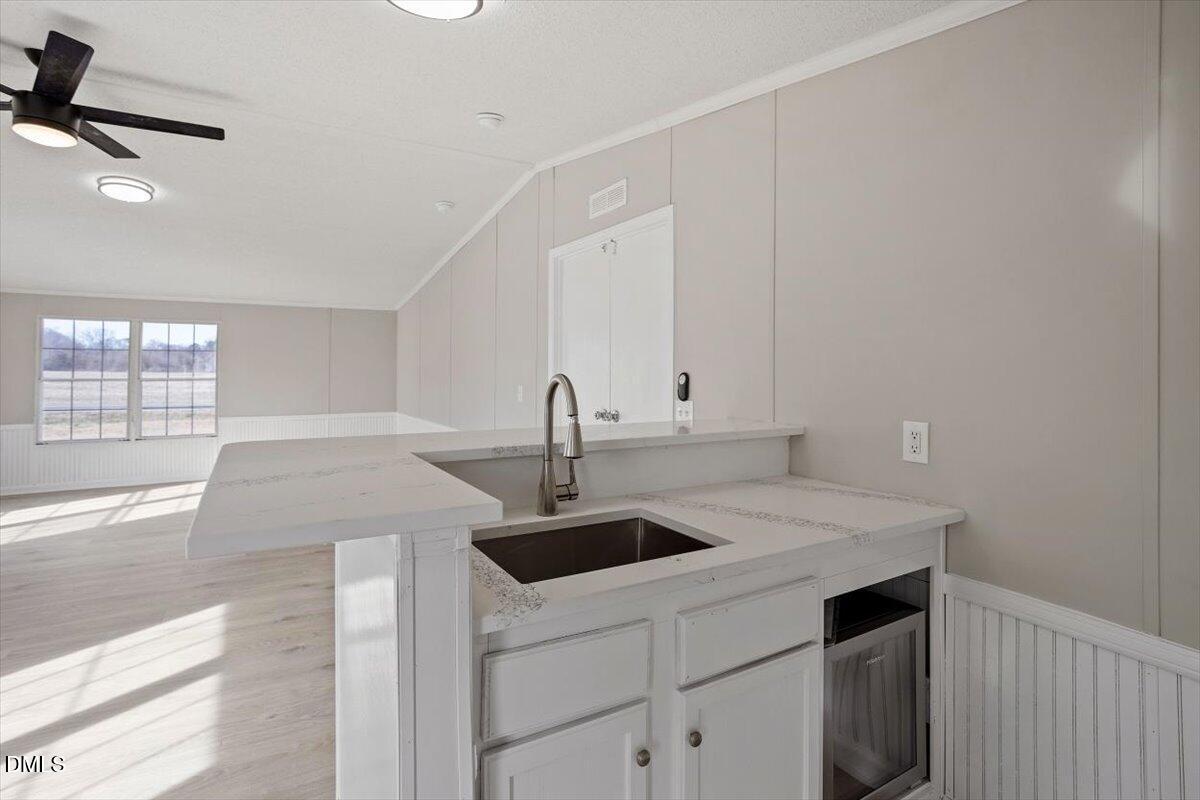 371 Woodland Church Road Dudley, NC 28333 - Photo 12 of 30 a kitchen with a sink and cabinets