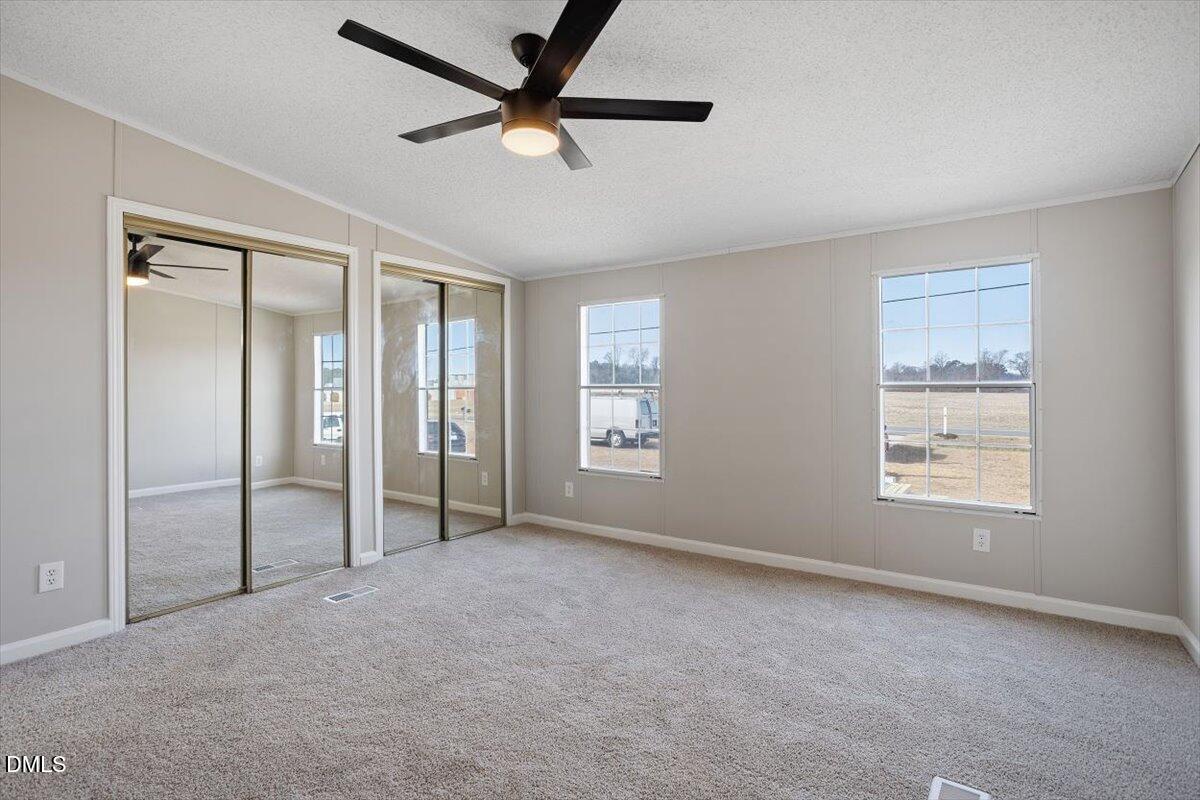 371 Woodland Church Road Dudley, NC 28333 - Photo 23 of 30 a view of an empty room with a window