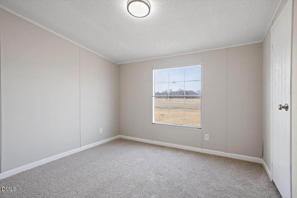 371 Woodland Church Road Dudley, NC 28333 - Photo 26 of 30 an empty room with a window