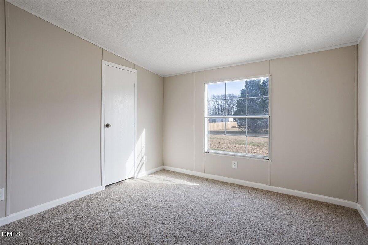 371 Woodland Church Road Dudley, NC 28333 - Photo 27 of 30 a view of an empty room with a window