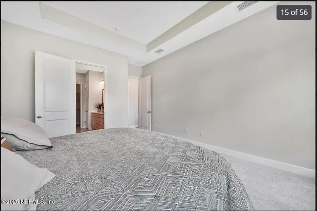 a bathroom with a double vanity sink and mirror