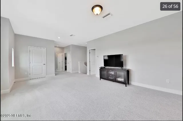 a bedroom with bed and window