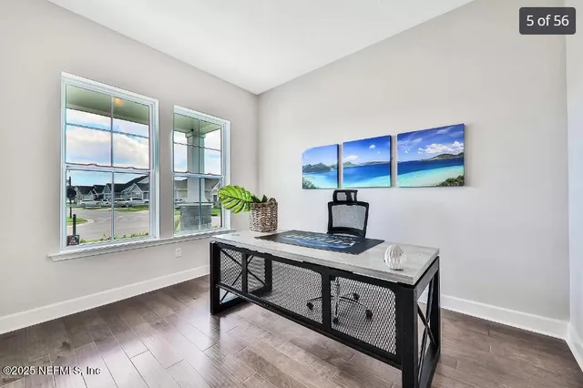 a kitchen with white cabinets and a stove