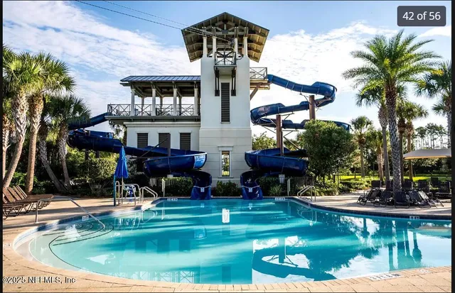 a view of a swimming pool with a garden