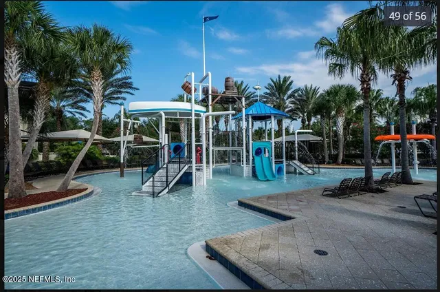 a view of a park with swings and a table