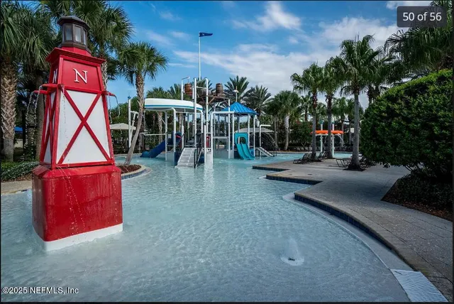 a view of a chairs and table in backyard