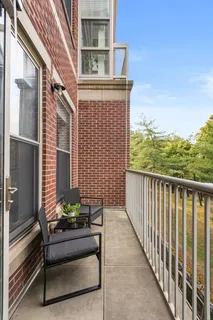 a view of balcony with furniture