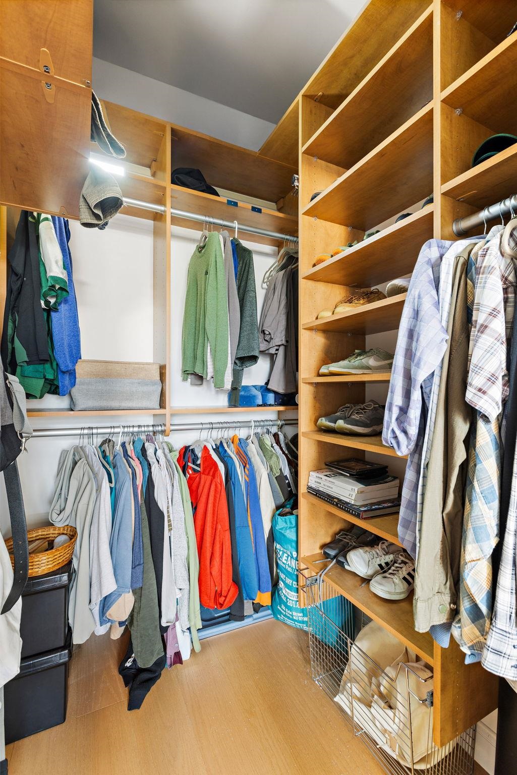 234 10th Street, Unit 306 Jersey City, NJ 07302 - Photo 8 of 15 a view of walk in closet with clothes and shoes
