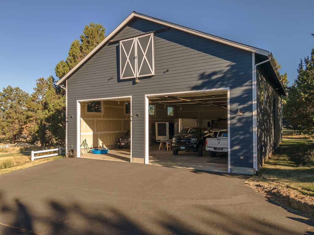 60675 Billadeau Road Bend, OR 97702 - Photo 57 of 87 Upstairs is built out storage and sliding barn doors that reveal windows.