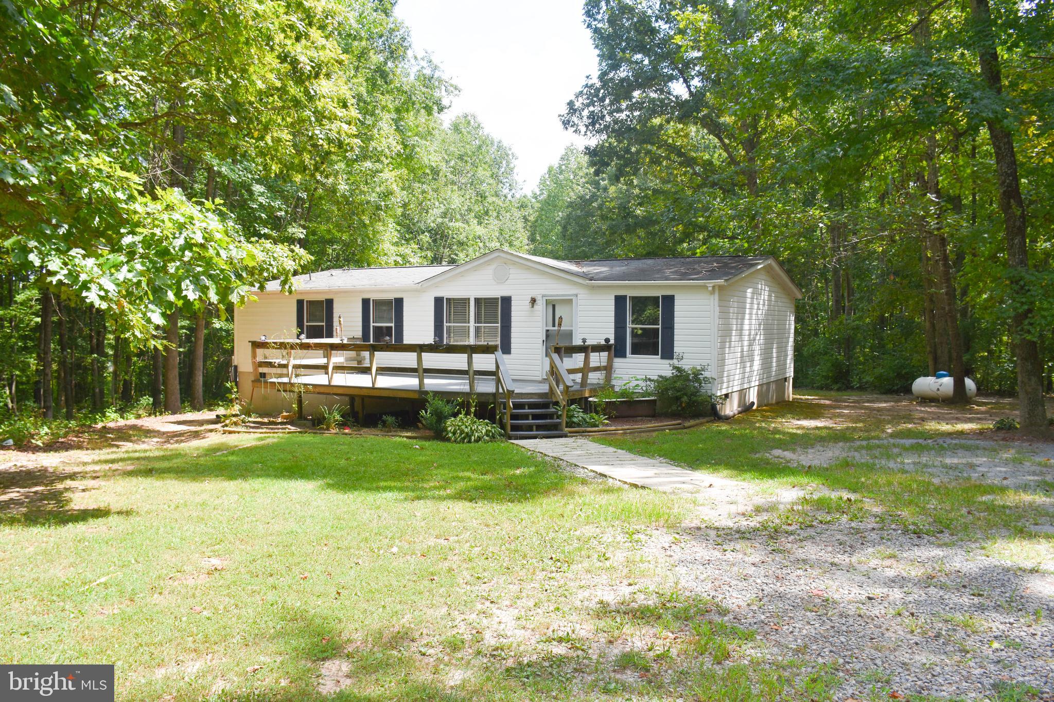 10000 Wallers Road Partlow, VA 22534 - Photo 11 of 15 a front view of a house with yard and green space