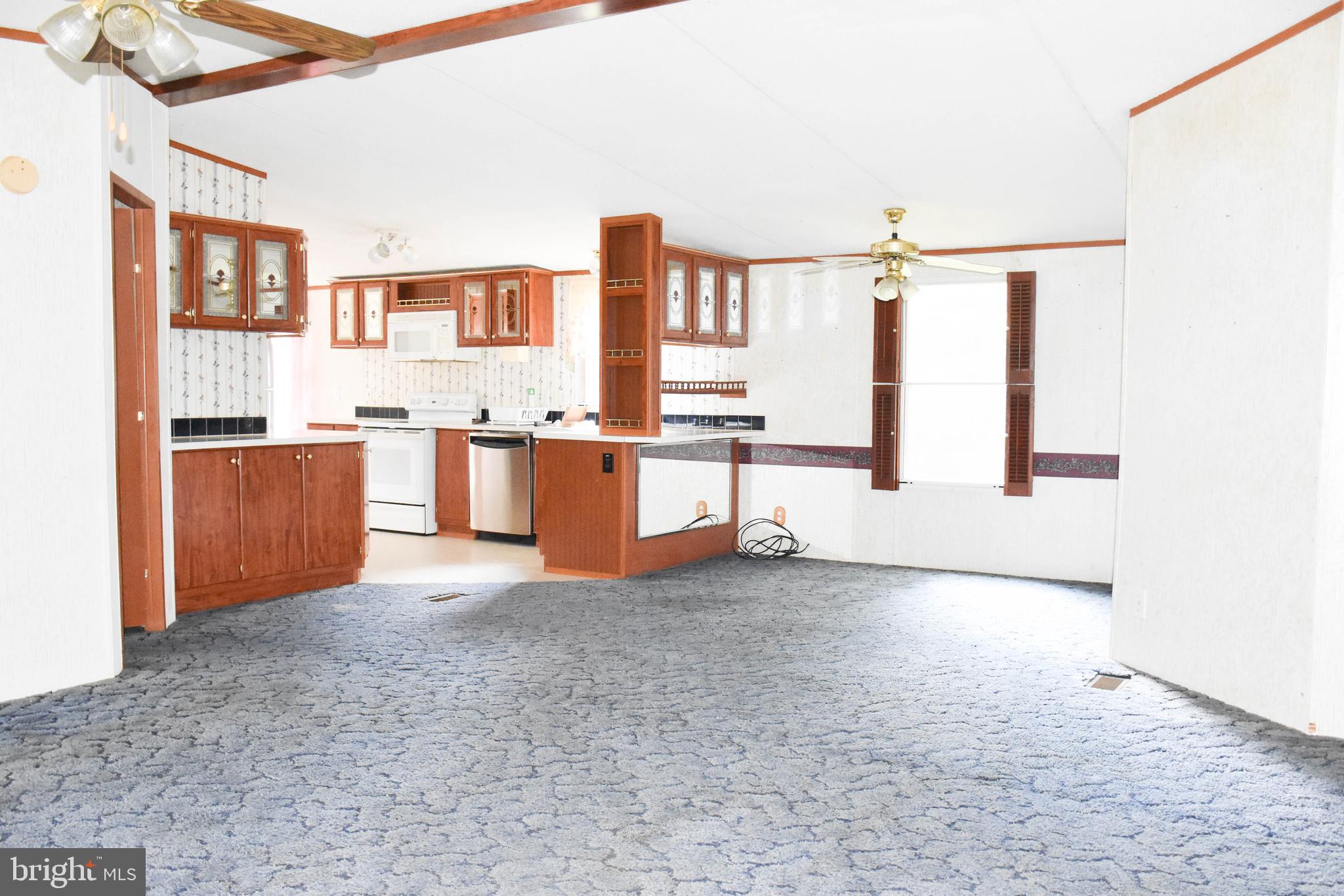 10000 Wallers Road Partlow, VA 22534 - Photo 3 of 15 a view of a kitchen with furniture and stainless steel appliances