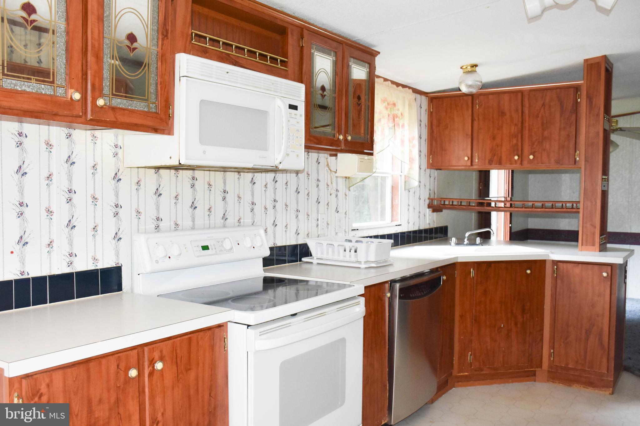 10000 Wallers Road Partlow, VA 22534 - Photo 5 of 15 a kitchen with a sink a stove and cabinets