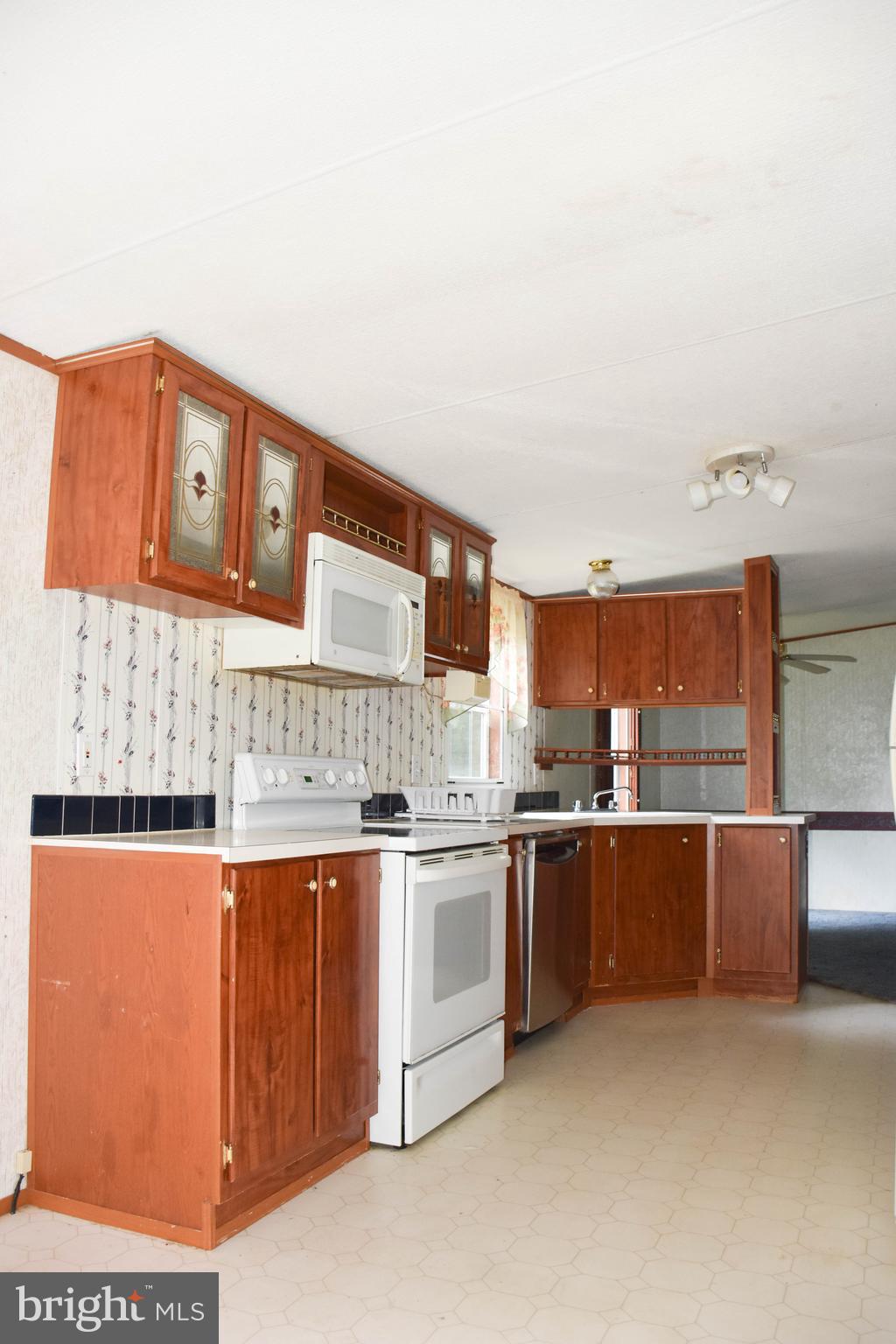 10000 Wallers Road Partlow, VA 22534 - Photo 7 of 15 a kitchen with stainless steel appliances granite countertop a stove and cabinets