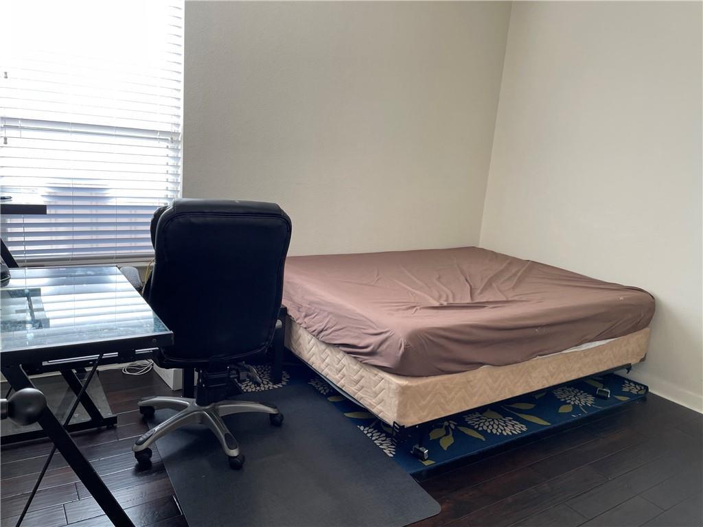16309 McAloon Way Austin, TX 78728 - Photo 12 of 16 Bedroom featuring dark wood-style flooring and an office area