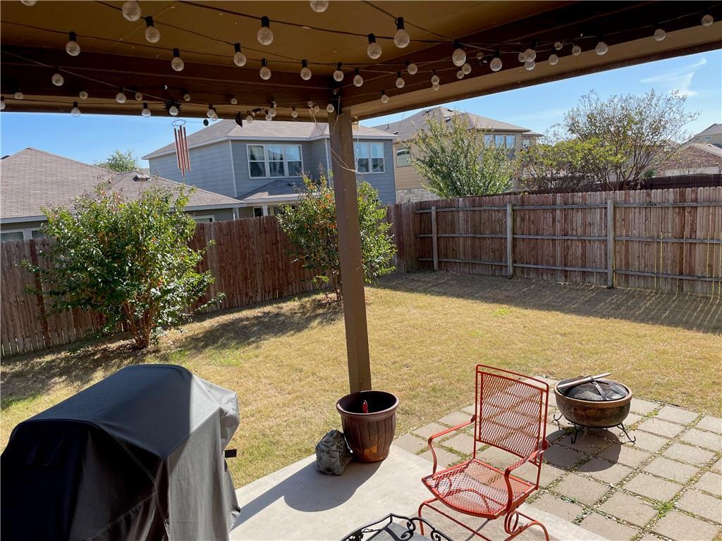 16309 McAloon Way Austin, TX 78728 - Photo 14 of 16 Fenced backyard with a patio area and a fire pit