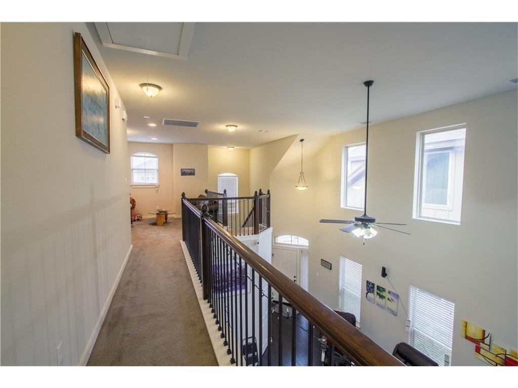 16309 McAloon Way Austin, TX 78728 - Photo 8 of 16 Hallway featuring attic access, carpet floors, and an upstairs landing