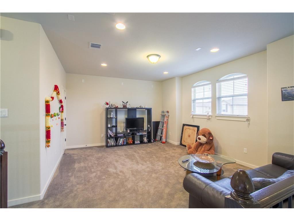 16309 McAloon Way Austin, TX 78728 - Photo 9 of 16 Carpeted living area with baseboards and recessed lighting