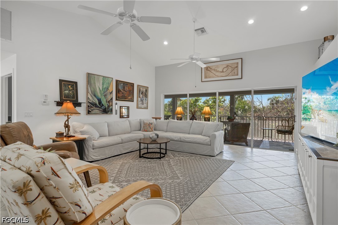 485 Peachtree Road Sanibel, FL 33957 - Photo 1 of 24 a living room with furniture and a flat screen tv