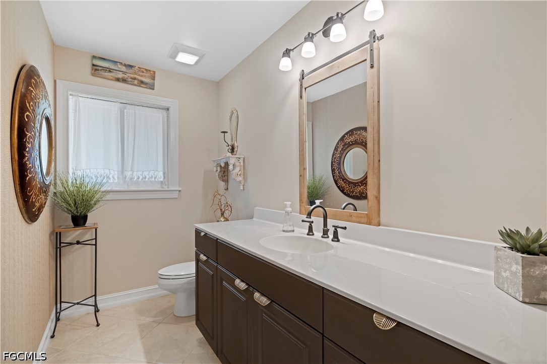 485 Peachtree Road Sanibel, FL 33957 - Photo 15 of 24 a bathroom with a sink a vanity and a mirror