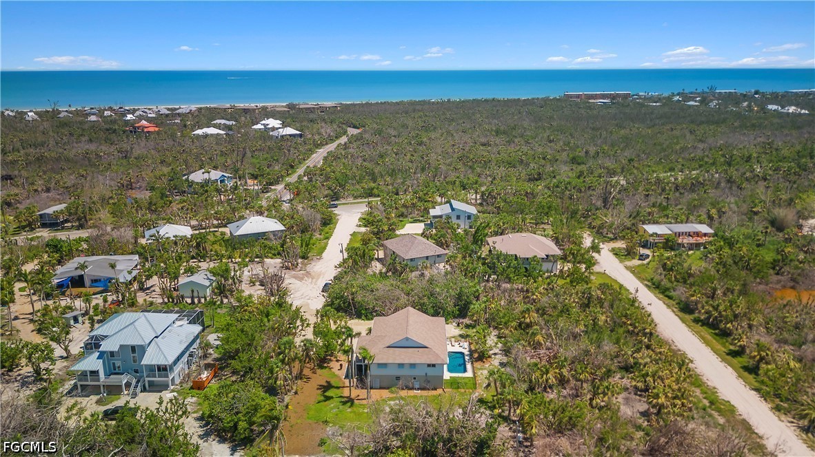 485 Peachtree Road Sanibel, FL 33957 - Photo 18 of 24 an aerial view of ocean and residential houses with outdoor space