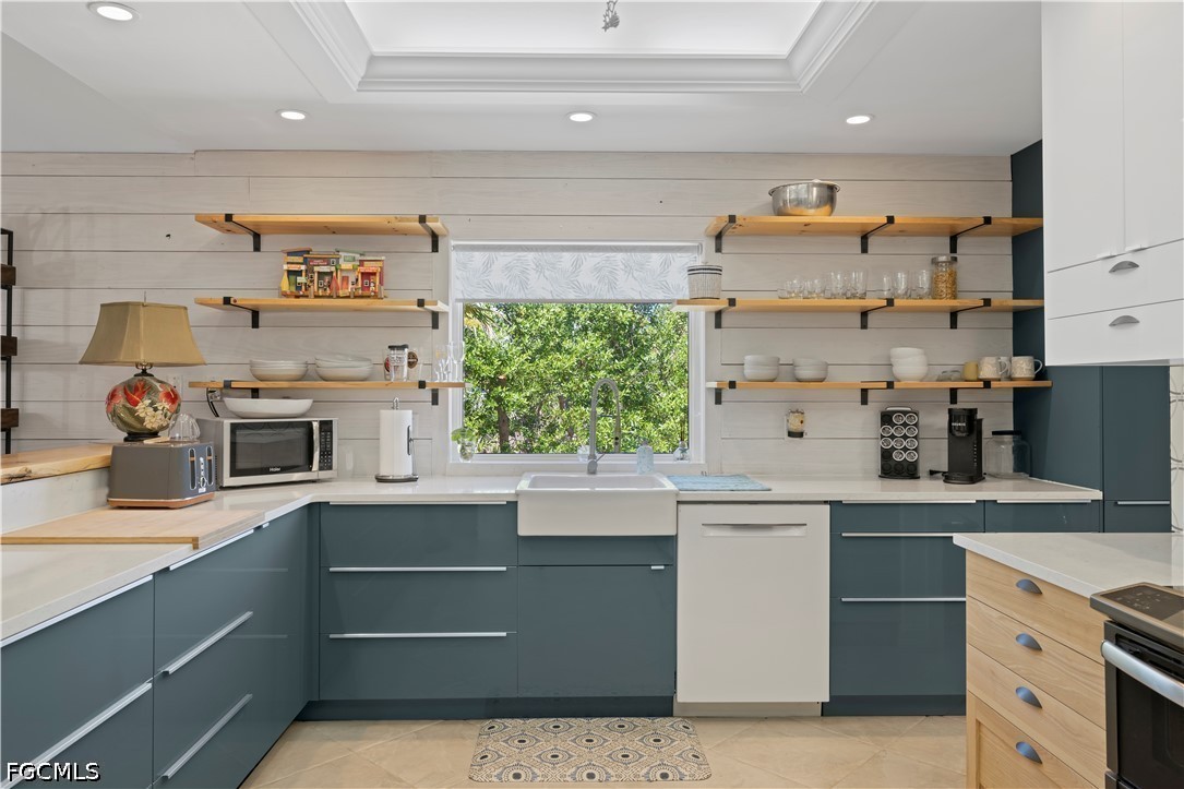 485 Peachtree Road Sanibel, FL 33957 - Photo 3 of 24 a kitchen with a sink window and cabinets
