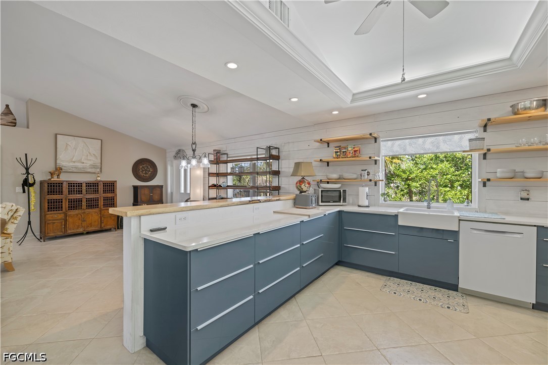 485 Peachtree Road Sanibel, FL 33957 - Photo 4 of 24 a kitchen with stainless steel appliances granite countertop a sink and cabinets