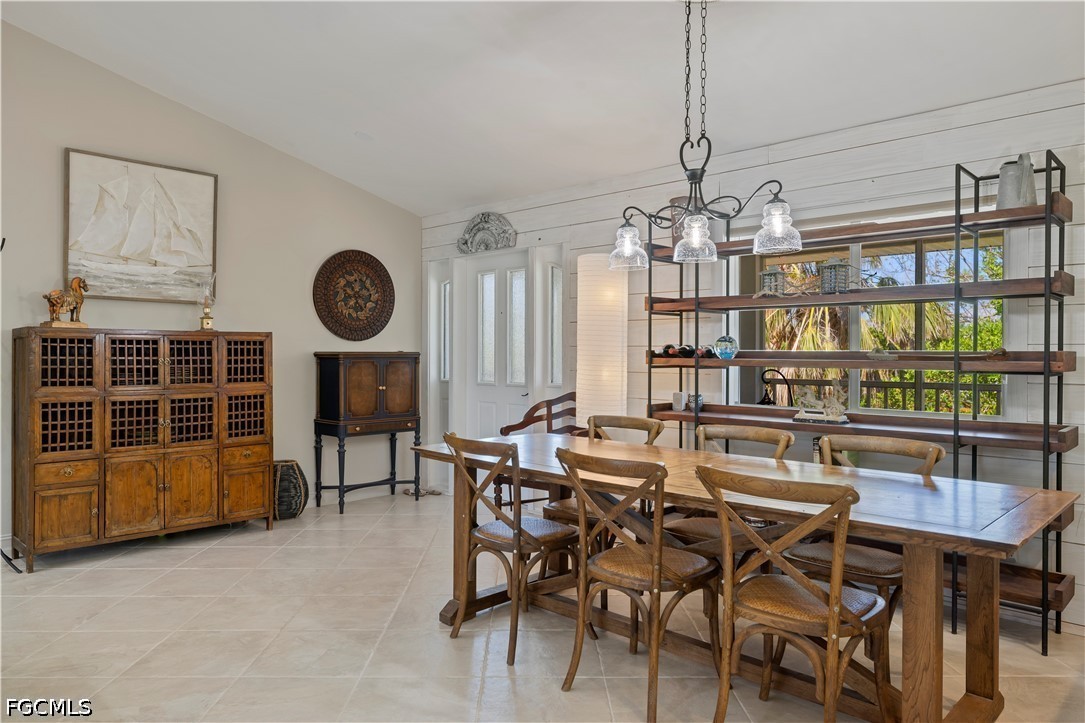 485 Peachtree Road Sanibel, FL 33957 - Photo 5 of 24 a view of a dining room and livingroom with furniture wooden floor and chandelier