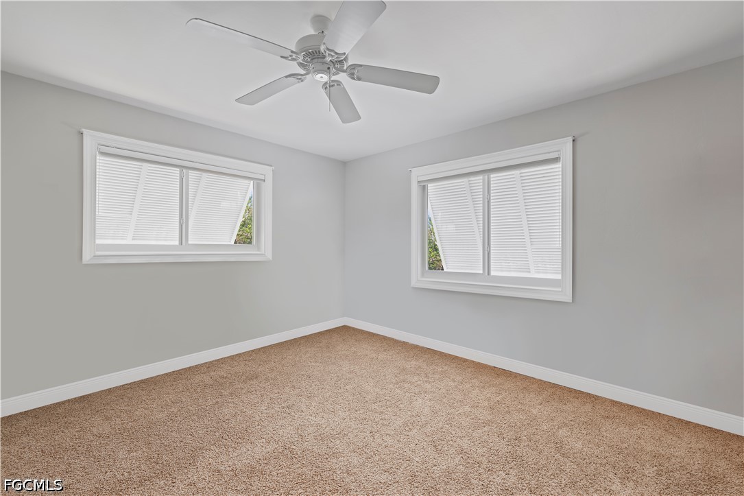 485 Peachtree Road Sanibel, FL 33957 - Photo 9 of 24 a view of an empty room with a window