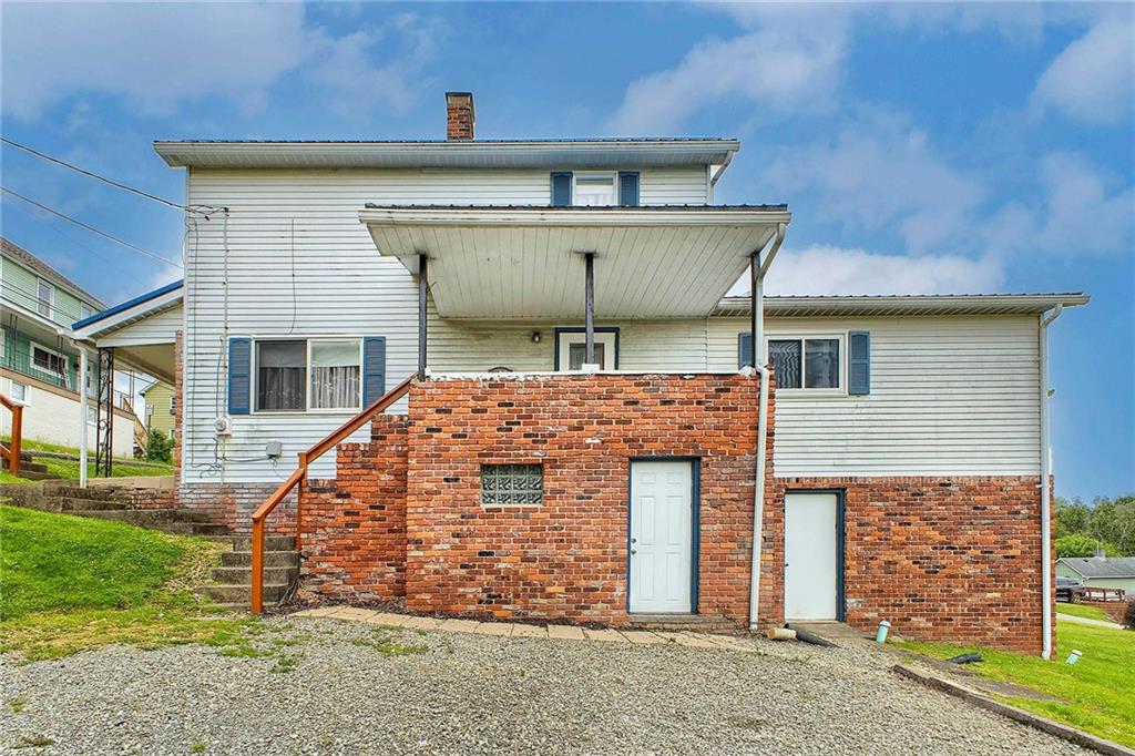 8002 Hayward Street Irwin, PA 15642 - Photo 29 of 31 a front view of a house with a yard