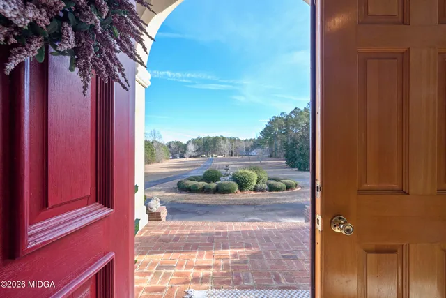 a front view of house with yard and outdoor seating