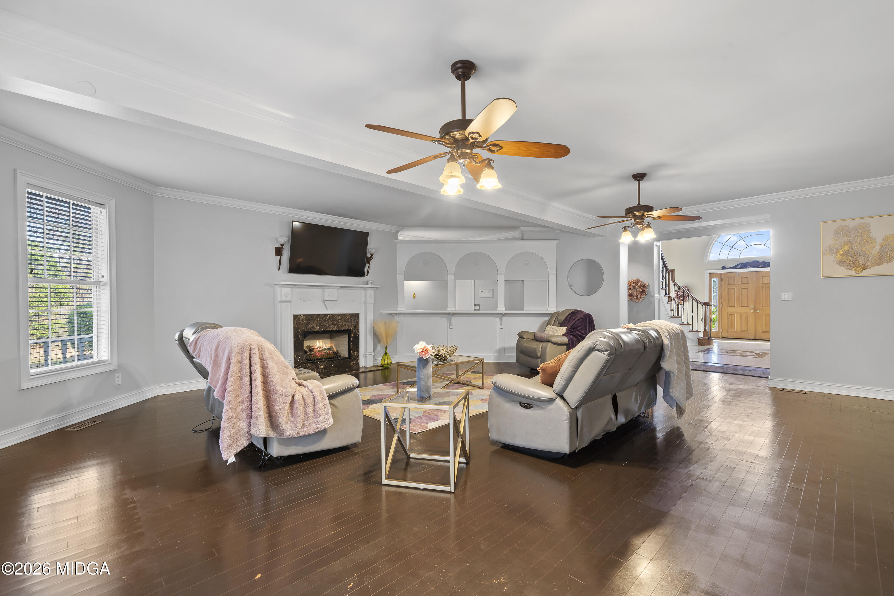 354 Lite-N-Tie Road Gray, GA 31032 - Photo 25 of 110 a living room with furniture a fireplace and a flat screen tv