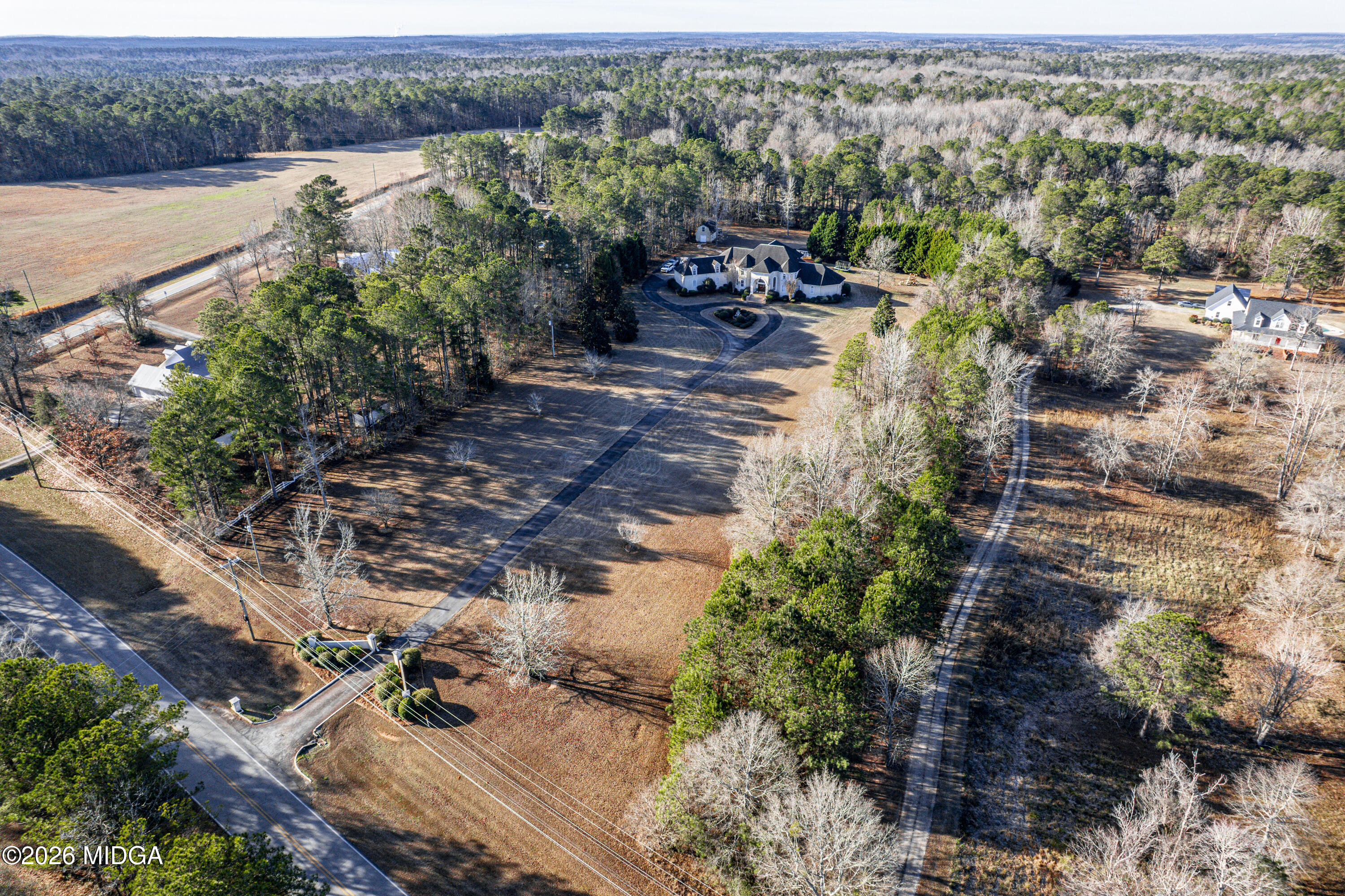 354 Lite-N-Tie Road Gray, GA 31032 - Photo 5 of 110 an aerial view of a house with a yard and lake view
